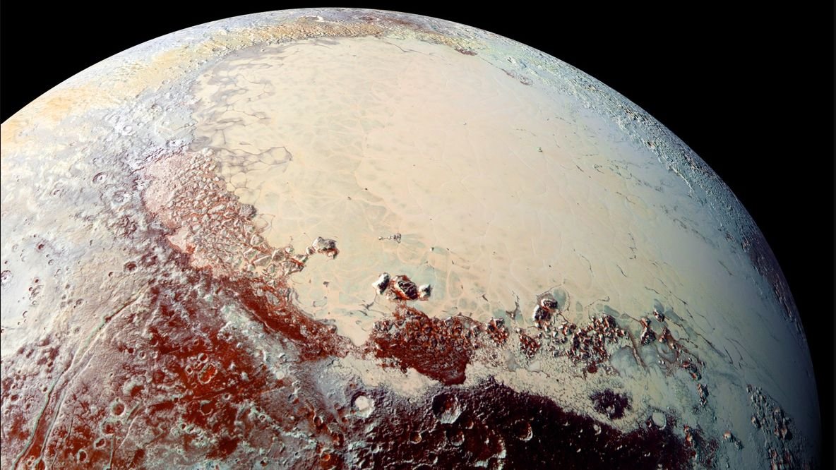 Pluto and its heart-shaped Sputnik Planitia as imaged by New Horizons spacecraft in 2015.